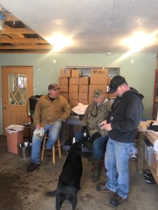 Dan, Bill, and Mike Dennis solving world problems while Otis observes.