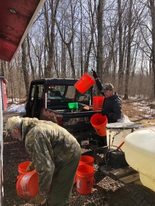 Bill and Mike unloading pails.