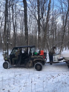 Bill at the wheel and me trying to clear the ice from the collection tank.